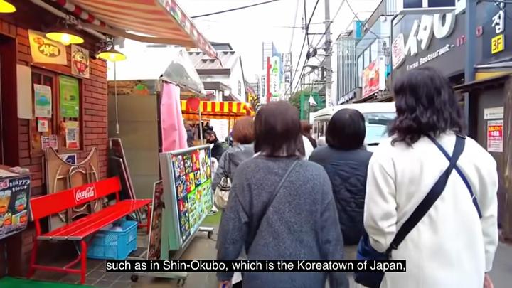 The narrator describes taking Korean freshmen to Shin-Okubo and Kabukicho, revealing the close proximity of Korea Town to Tokyo's red-light district.